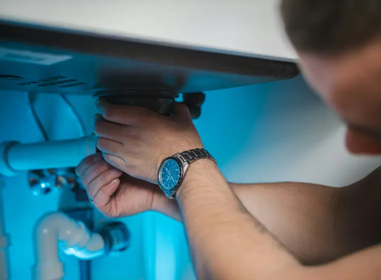 A technician servicing equipment at a customer's property